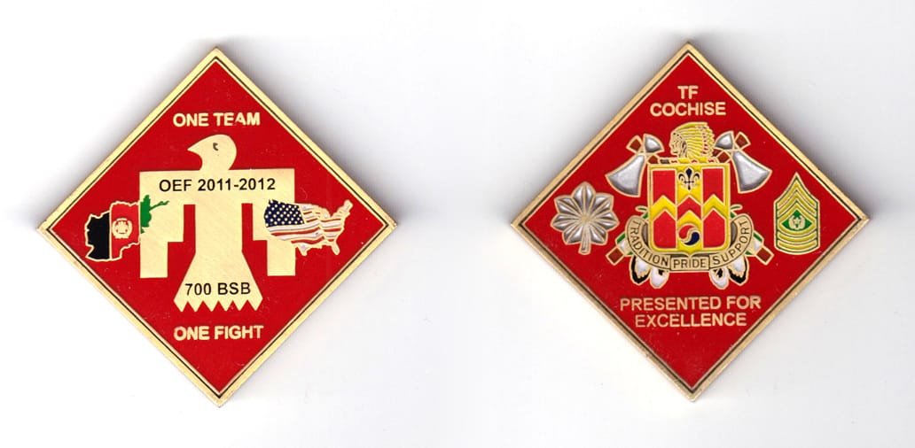 Diamond shaped, bronze colored coin, 2 inches high x 2  inches wide.