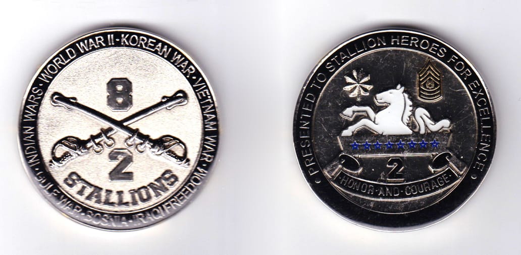 Round shaped, silver colored coin, 2 inches in diameter.