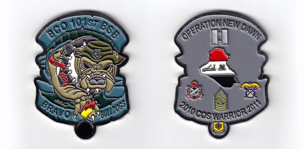 Bulldog shaped with banners above and below and a lit bomb protruding below the bottom banner, silver in color, 3 inches...