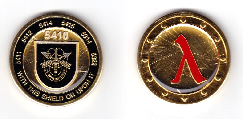 Round shaped coin, brass in color, 1 3/4 inches in diameter.