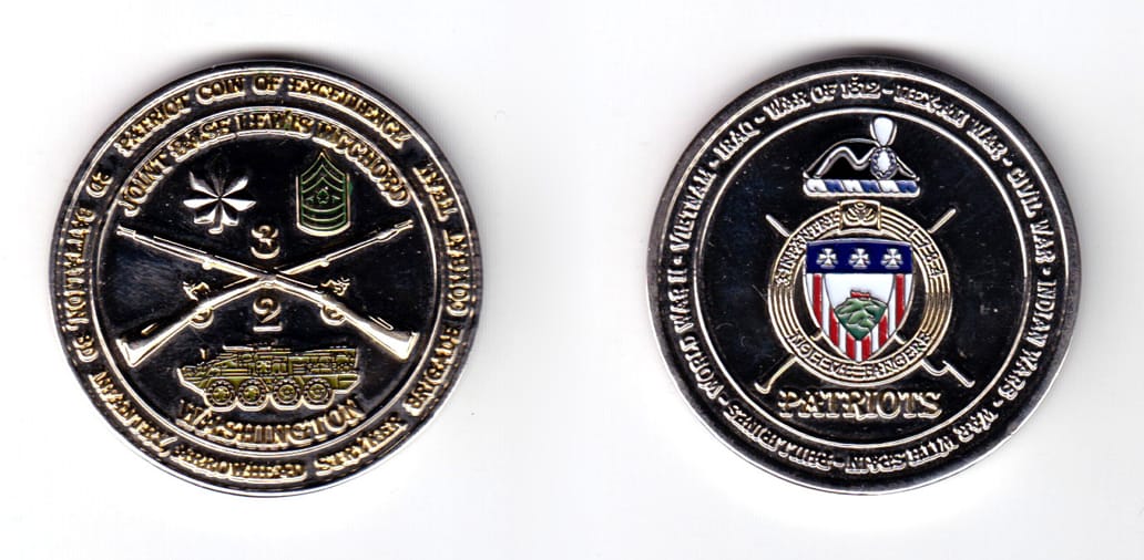 Round shaped coin, silver in color, 1 3/4 inches in diameter.