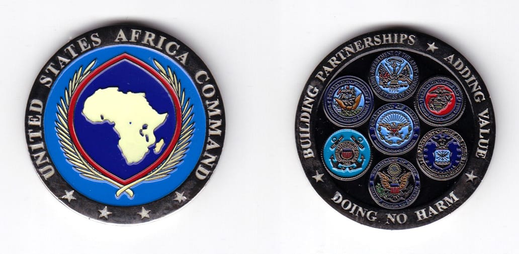 Round shaped coin, pewter in color, 1 49/64 inches in diameter.