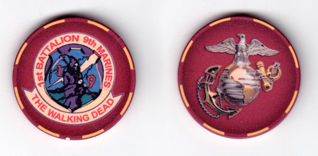 Round shaped poker chip, red and white in color, 1 1/2 inches in diameter.