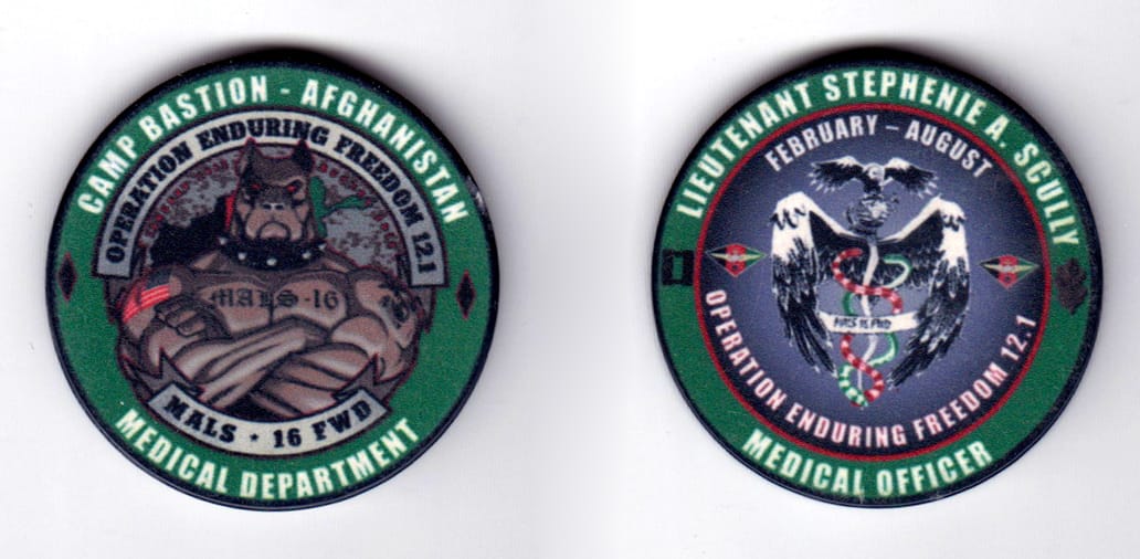 Round shaped poker chip, green in color with a black edge, 1 5/8 inches in diameter.