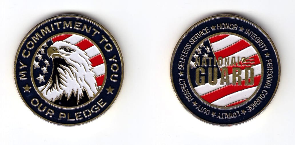 Round shaped coin, gold in color, 1 1/2 inches in diameter.