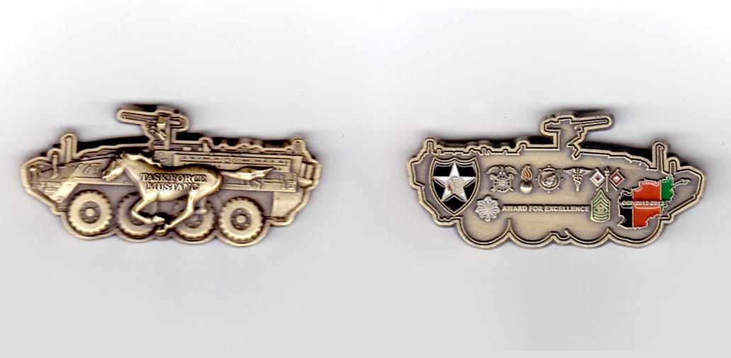 Armored vehicle shaped coin, antique brass in color, 1 inch high x 2 1/4 inches wide.