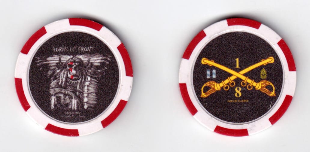 Round shaped poker chip, red and white in color, 1 37/64 inches in diameter.
