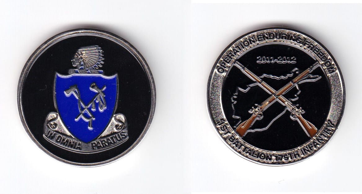 Round shaped coin, silver in color, 1 1/2 inches in diameter.