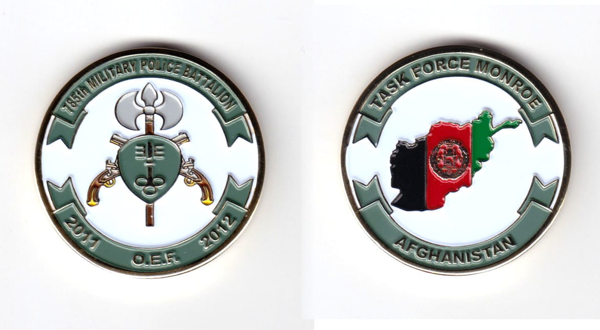 Round shaped coin, brass in color, 1 1/2 inches in diameter.