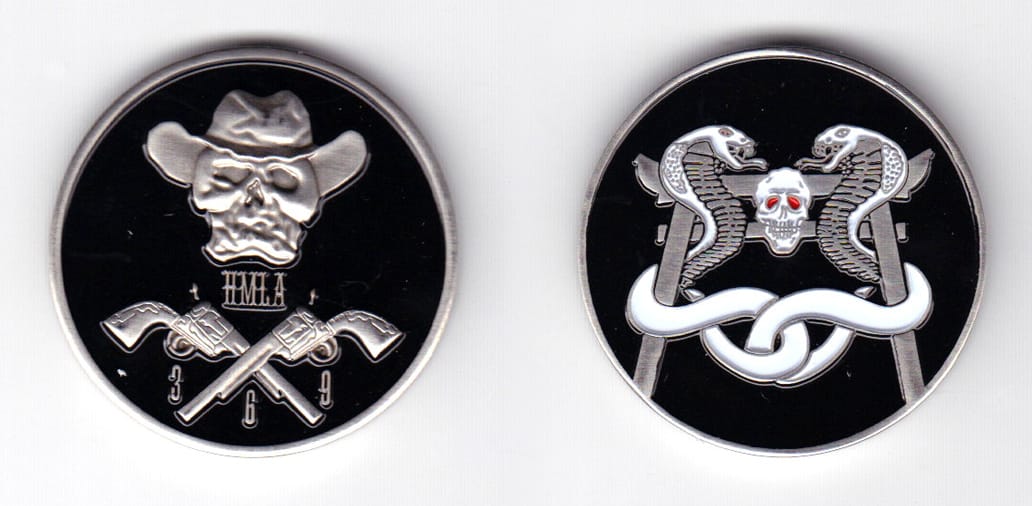 Round shaped coin, pewter in color, 1 33/64 inches in diameter.