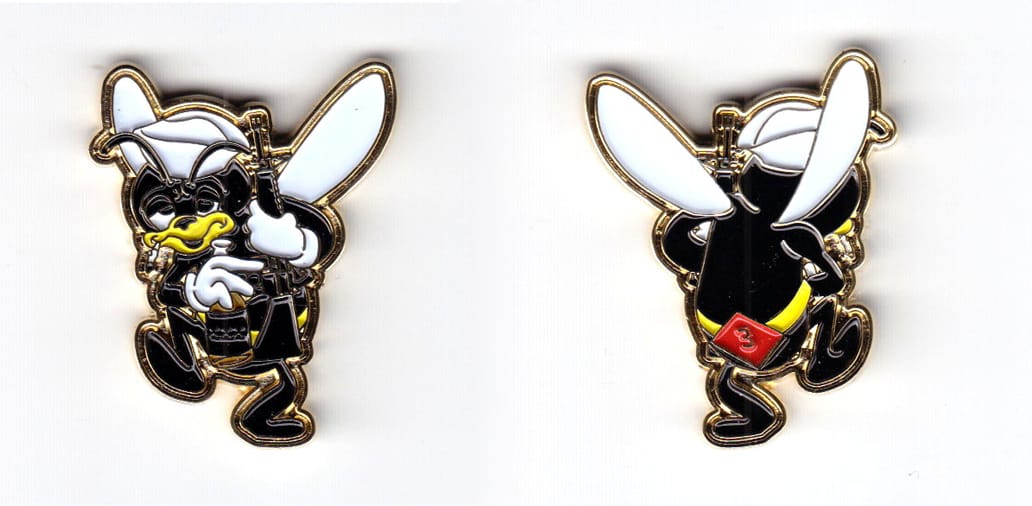 Cartoon hornet shaped coin, brass in color, 1 37/64 inches high x      1 11/64 inches wide.