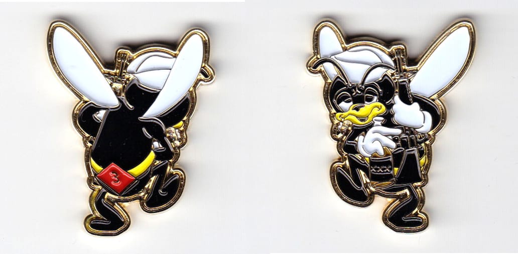 Cartoon hornet shaped coin, brass in color, 1 37/64 inches high x       1 11/64 inches wide.