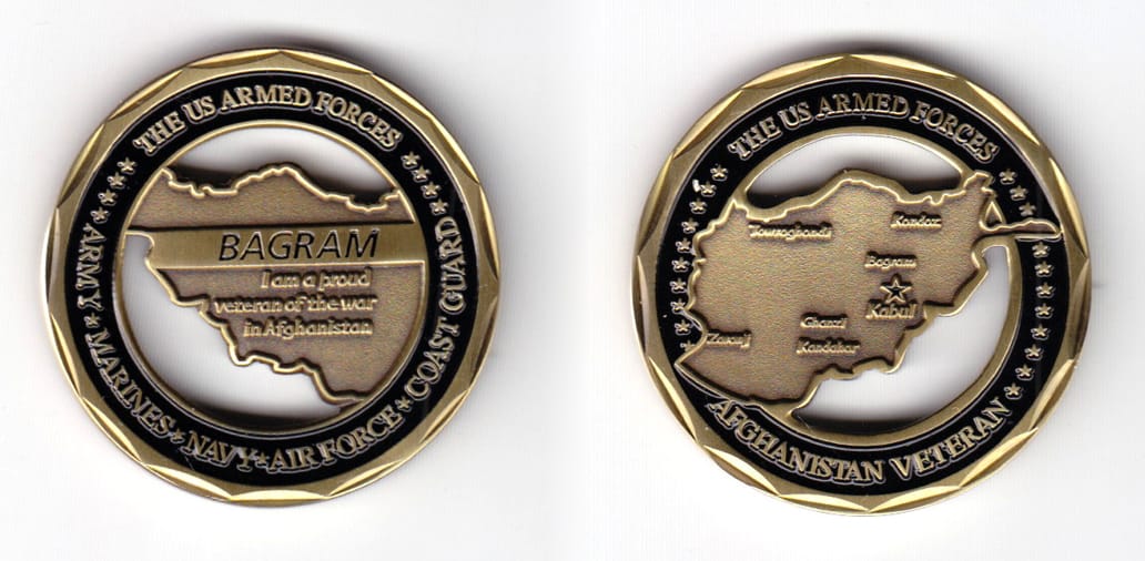 Round shaped coin, brass in color, 1 39/64 inches in diameter.