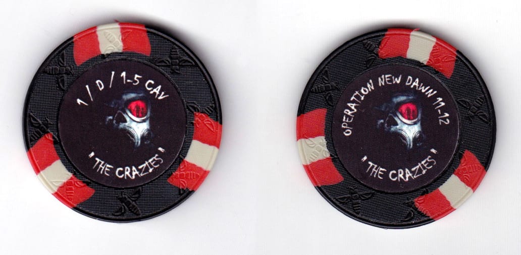 Round shaped poker chip, black in color, 1 37/64 inches in diameter.
