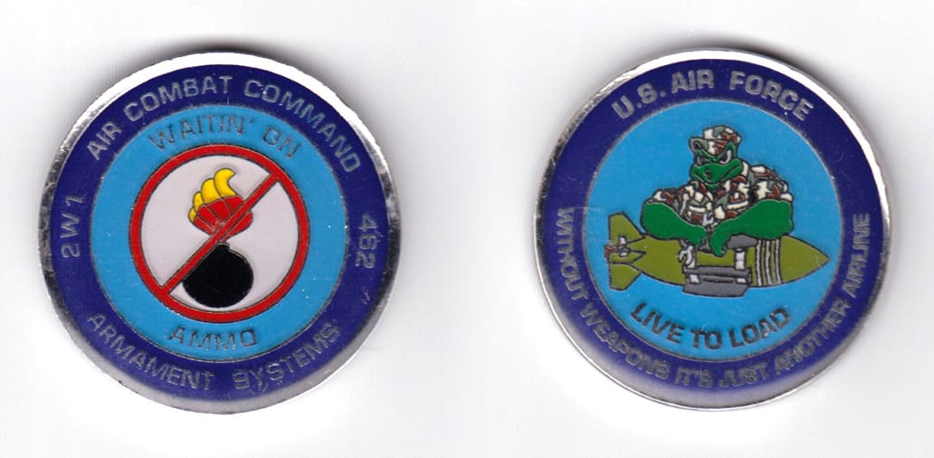 Round shaped coin, silver in color, 1 39/64 inches in diameter.