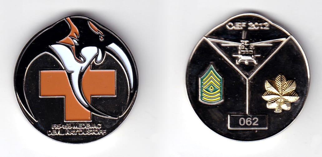 Round shaped coin with slight bulge at top, silver in color, 1 3/4 inches high x 1 11/16 inches wide.