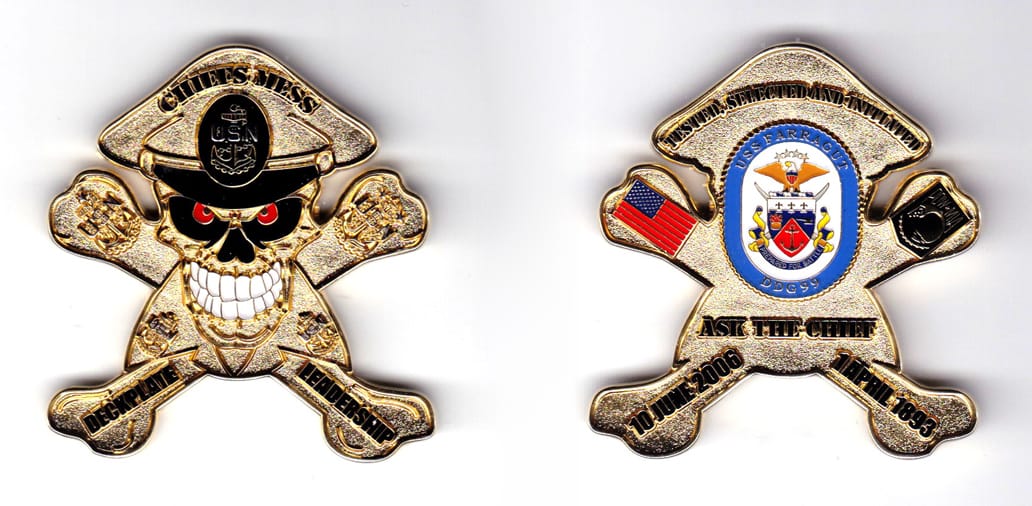 Skull and crossbones shaped coin wearing a combination cap, brass in color, 2 19/64 inches high x 2 7/64 inches wide.