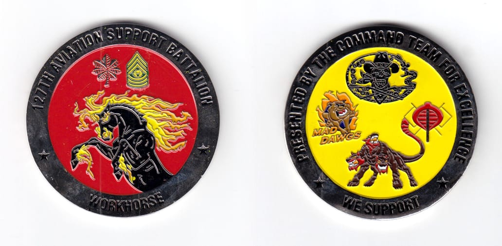 Round shaped coin, silver in color, 2 1/4 inches in diameter.