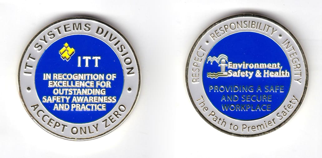 Round shaped coin, gold in color, 1 3/4 inches in diameter.