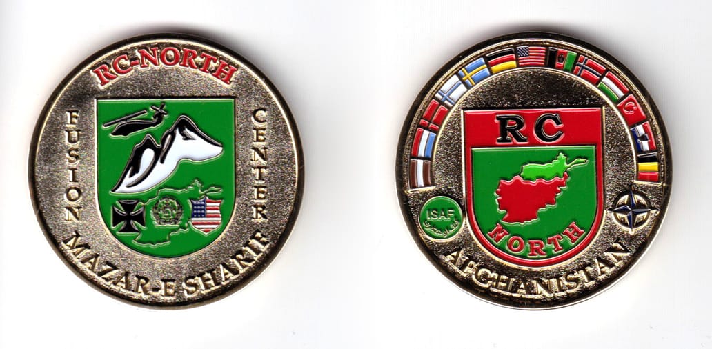 Round shaped coin, gold in color, 1 3/4 inches in diameter.