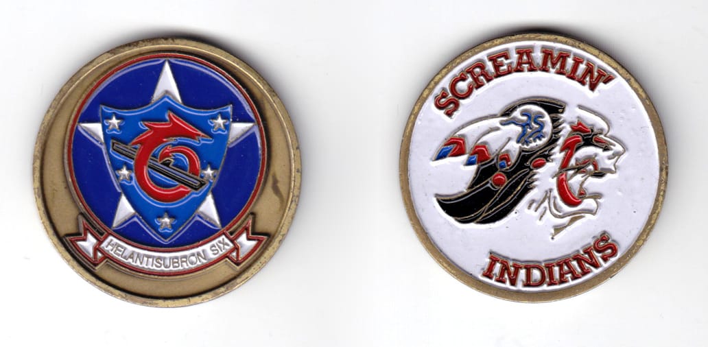 Round shaped coin, antique brass in color, 1 25/32 inches in diameter.