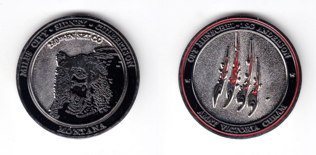 Round shaped coin, silver in color, 1 3/4 inches in diameter.