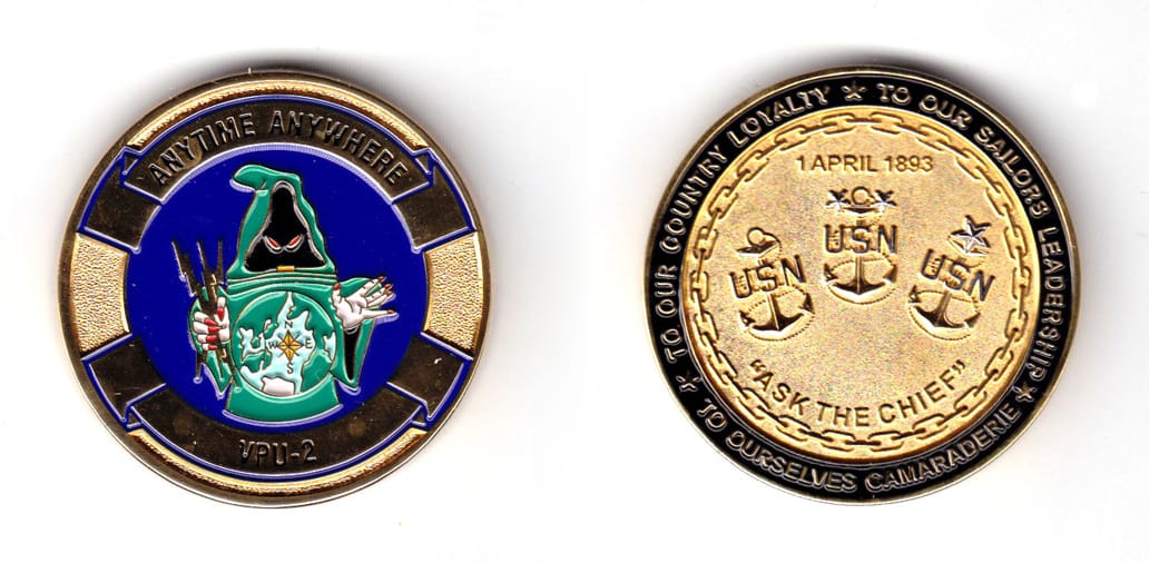 Round shaped coin, antique brass in color, 1 47/64 inches in diameter.