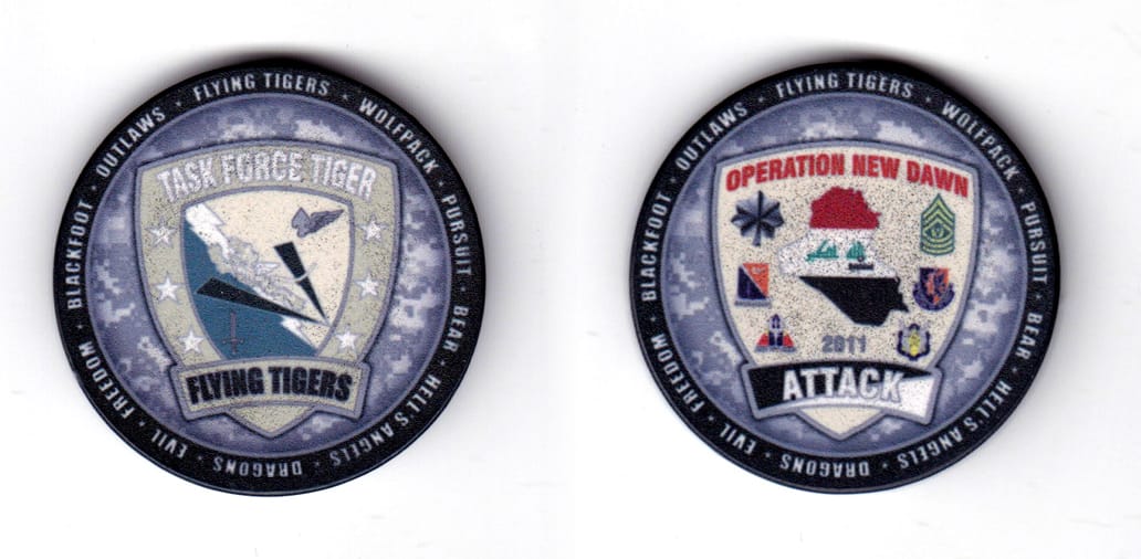 Round shaped poker chip, gray & black in color, 1 51/64 inches in diameter.