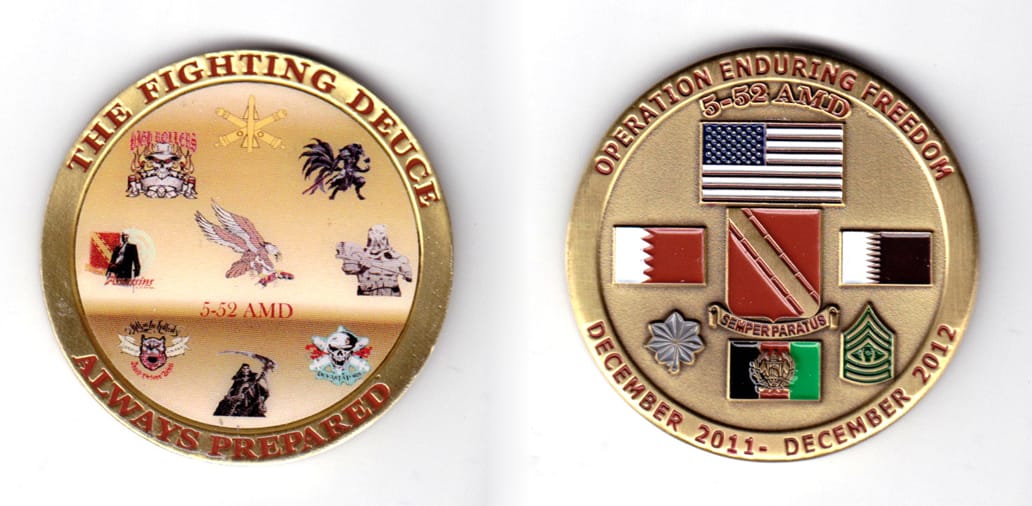 Round shaped coin, antique brass in color, 2 inches in diameter.