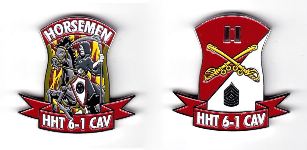 Shield shaped coin with ribbon banner mounted below, silver in color, 2 1/32 inches high x 2 inches wide.