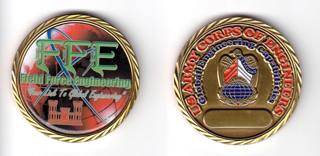 Round shaped coin, brass in color, 1 61/64 inches in diameter.