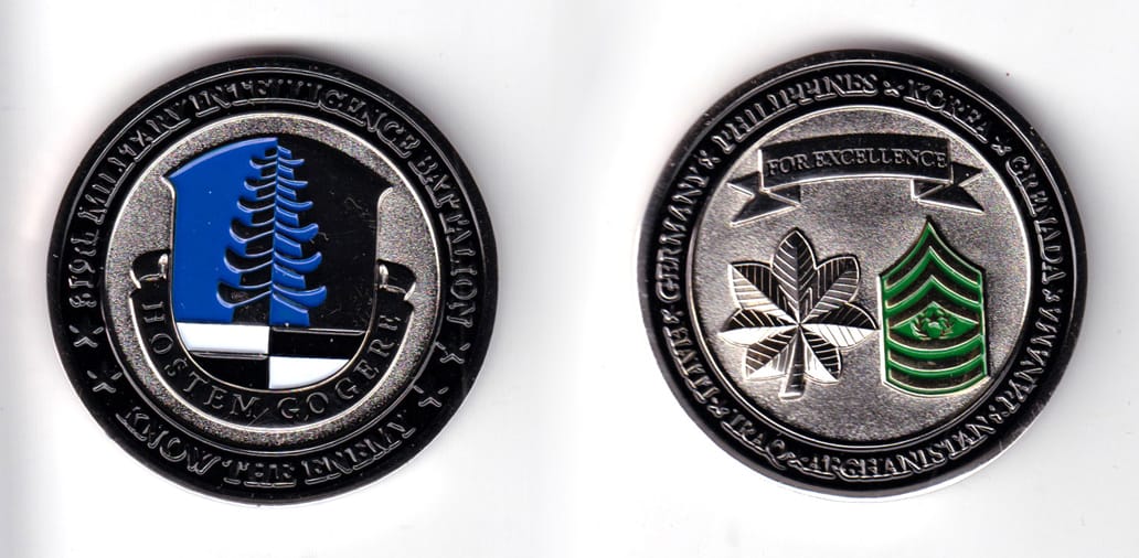 Round shaped coin, chrome in color, 2 1/32 inches in diameter.