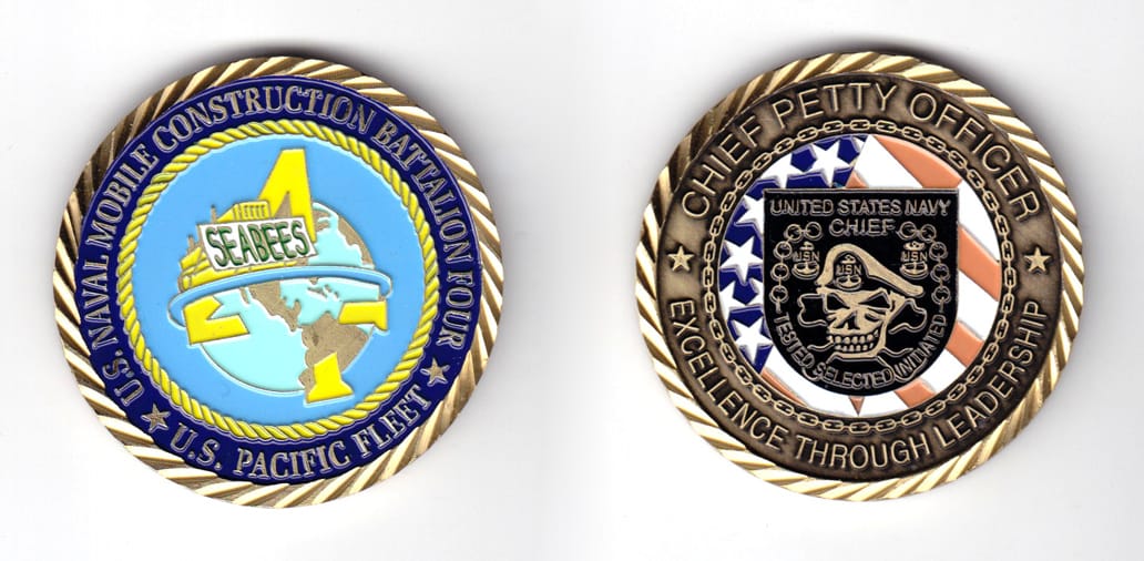 Round shaped coin, brass in color, 2 inches in diameter.