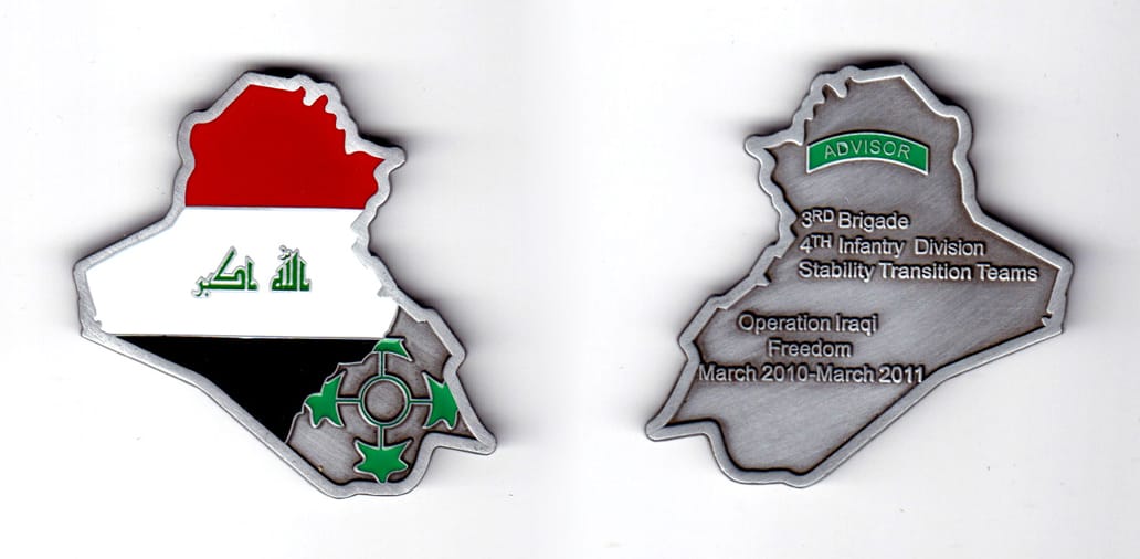 Coin shaped like the map of Iraq, pewter in color, 1 31/64 inches high x 2 1/64 inches wide.