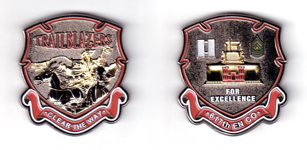 Shield shaped coin with small notches cut out at 9, 11, 1 and 3 o'clock and a ribbon banner under, pewter in color, 2 1/...