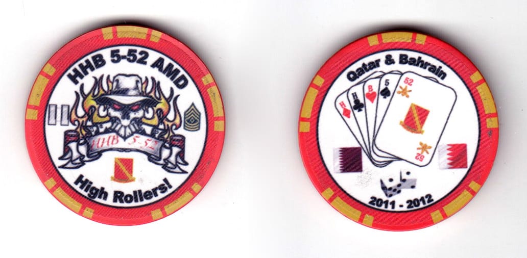 Round shaped poker chip, red & white in color, 1 17/32 inches in diameter.