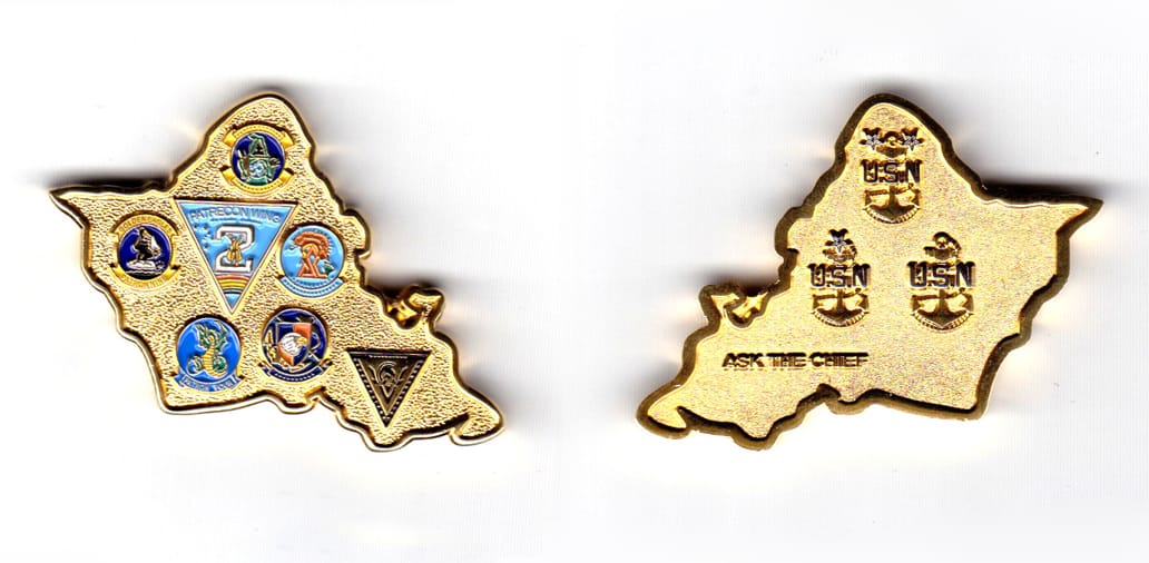 Coin is shaped like an outline of the map of Afghanistan, gold in color, 1 17/32 inches high x 2 5/32 inches wide.