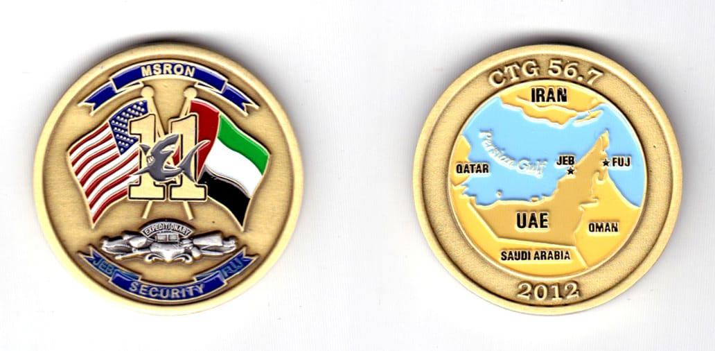 Round shaped coin, brass in color, 1 1/2 inches in diameter.