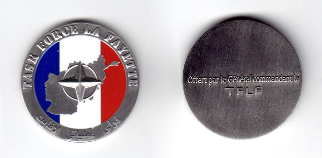 Round shaped coin, pewter in color, 1 3/8 inches in diameter.