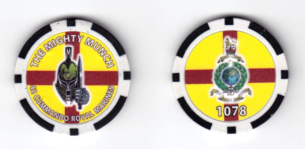 Round shaped poker chip, black & white in color, 1 37/64 inches in diameter.