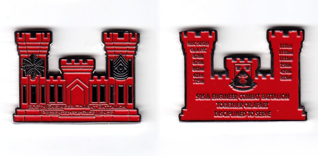 Engineer castle shaped coin, silver in color, 1 1/16 inches high x 2 inches wide.