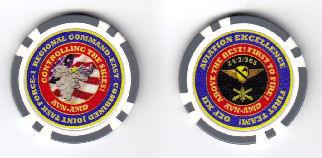 Round shped poker chip, gray & white in color, 1 3/8 inches in diameter.