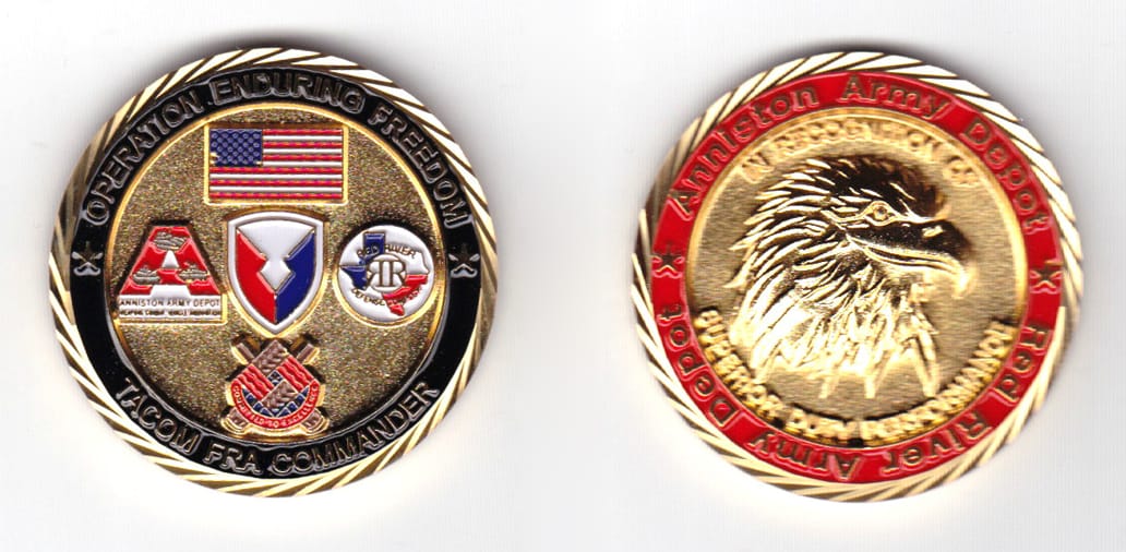 Round shaped coin, gold in color, 1 37/64 inches in diameter.