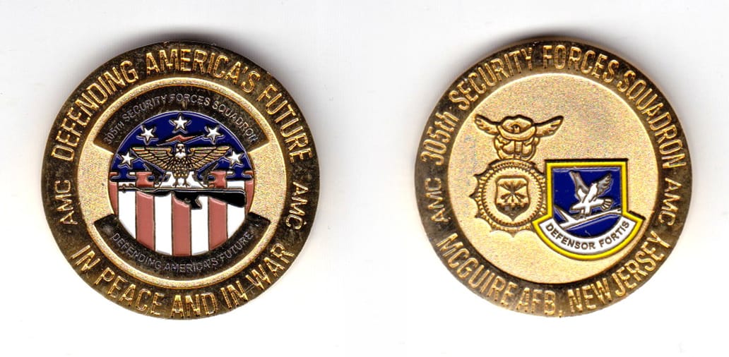 Round shaped coin, gold in color, 1 31/64 inches in diameter.