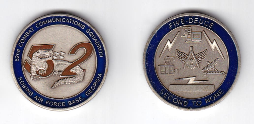 Round shaped coin, pewter in color, 1 17/32 inches in diameter.