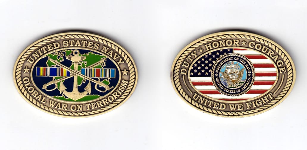 Oval shaped coin, antique brass in color, 1 31/64 inches high x 2 1/8 inches wide.