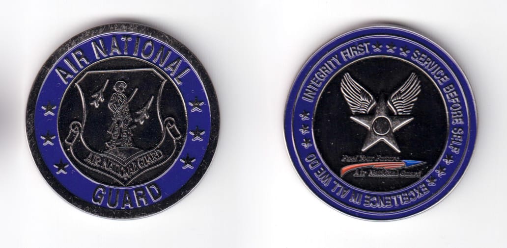 Round shaped coin, pewter in color, 1 47/64 inches in diameter.