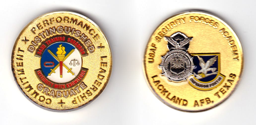 Round shaped coin, gold in color, 1 25/32 inches in diameter.