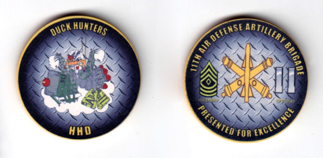 Round shaped poker chip, gray with yellow edge in color, 1 43/64 inches in diameter.