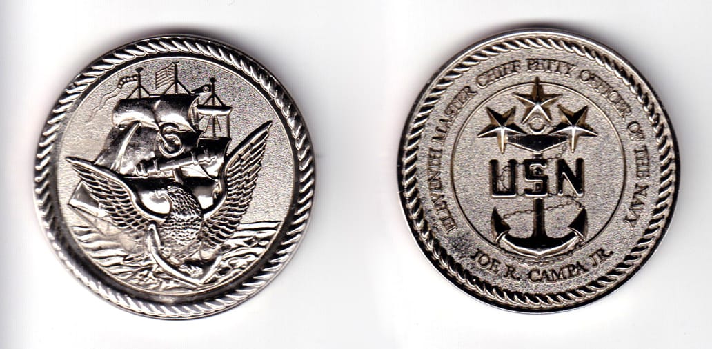 Round shaped coin silver in color, 2 inches in diameter.